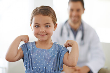 Pediatrician, young girl and arm with flex for strong, brave and happiness for treatment. Doctor,...