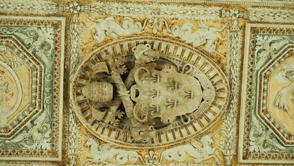 Fototapeta na wymiar papal coat of arms on the ceiling in Angel castle