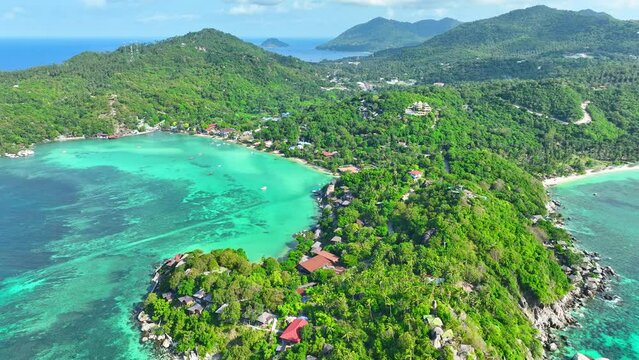 Koh Tao, Thailand, renowned for its world-class dive sites, teeming with marine life and stunning underwater landscapes. Aerial view. Nature stock footage. Beach background. 4K UHD.

