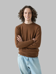 Portrait of handsome smiling young man with folded arms. Smiling joyful cheerful student men with crossed hands studio shot. Isolated on gray background - 746317862