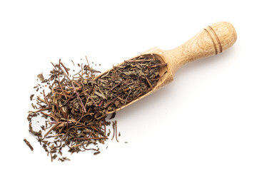 Top view of a wooden scoop filled with dry Organic Spearmint or Pudina (Mentha Spicata) stem and...