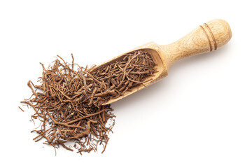 Top view of a wooden scoop filled with Organic sarpagandha  (Rauvolfia serpentina) roots. Isolated...
