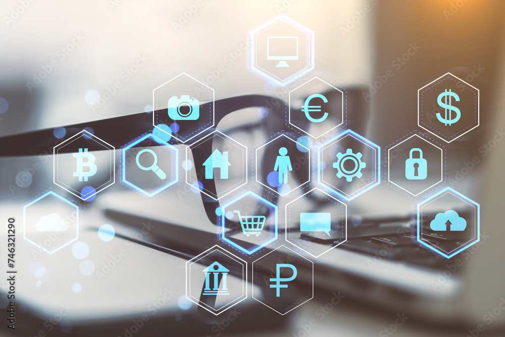 Poster Close up of laptop, eyeglasses and smartphone on desk with abstract hexagonal pattern hologram with various business icons on blurry background. Digital dashboard and data concept. Double exposure.