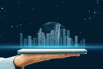 An image showing a hand presenting a holographic projection of a modern cityscape against a starry...