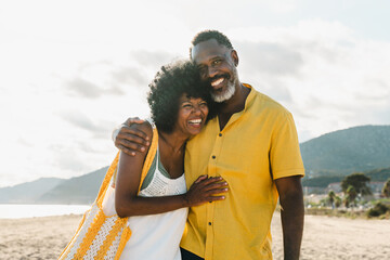 Beautiful mature black couple of lovers dating at the seaside - Married african middle-aged couple...