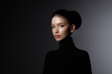 Captivating portrait of a poised woman in a sleek black turtleneck, her visage the epitome of...
