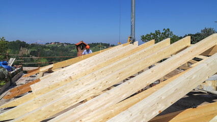 Fototapeta na wymiar construction site - renovation of a roof - wooden beams