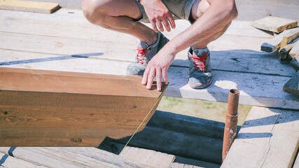 renovating a roof - construction site, workers at work
