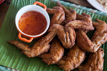 Fried crispy chicken wings with sweet sauce