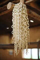 Inau or inaw a wooden ritual wood-shaving stick used by Ainu people for prayers to kamuy gods in...