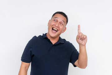 Joyful middle aged Asian man having an epiphany, realizing the solution with a cheerful expression...