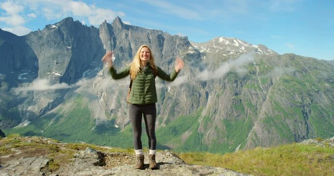Mountains, nature or happy woman in outdoor vlog with confidence or smile on a holiday vacation. Online, influencer or excited person hiking in Norway to travel for recording, video or live streaming