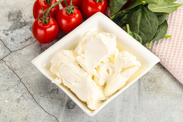 Soft cream cheese in the bowl