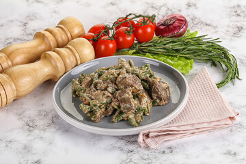 Fried turkey liver with herbs in cream sauce