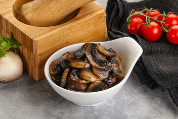 Roasted champignon mushrooms in the bowl