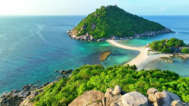 Immerse yourself in the serenity of a secluded island with pristine sands, perfect for snorkeling among colorful marine creatures and sunbathing bliss. Koh Tao, Southern Thailand. 4K HDR.     
