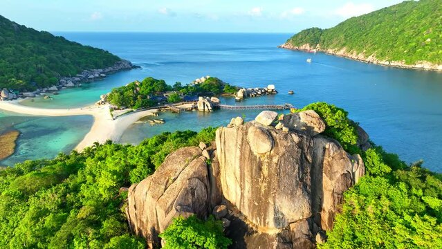 Dive into an aquatic wonderland on our island's powdery sandbar. Snorkel with vibrant marine life or soak up the sun in blissful tranquility. Aerial drone. Tropical background. Tao island, Thailand. 
