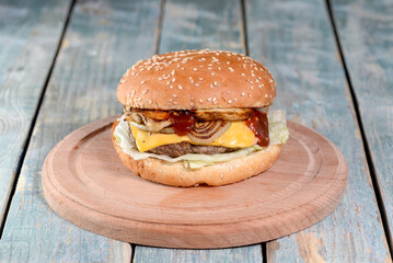 burger on a wooden board