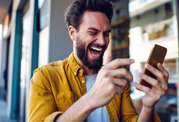 A Man Is smiling and Looking At his smartphone