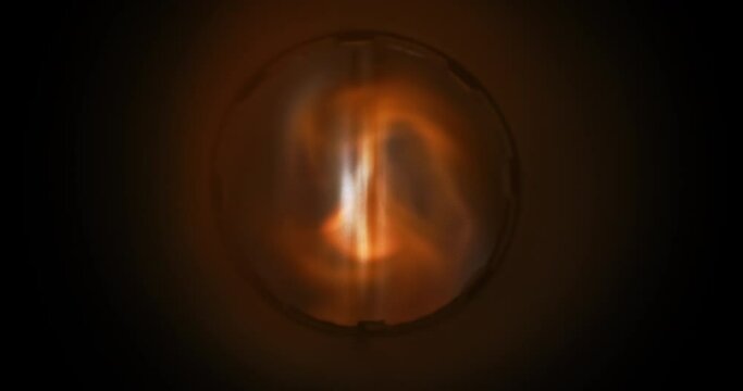 Vortex of fire forming inside machine tubing. Radiating heat waves