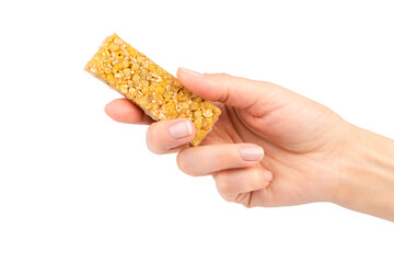 Woman's hand holds energy protein bar isolated on white background. Close-up.