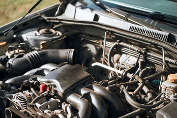 A car with a 6-cylinder boxer engine that needs service and repair - obrazy, fototapety, plakaty
