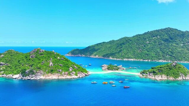 Koh Nangyuan, Thailand's gem, boasts turquoise waters, powdery beaches, and surreal snorkeling. Stock footage. Koh Tao, Surat Thani Province, Southern Thailand.Koh Nangyuan, Southern Thailand. 4K.
