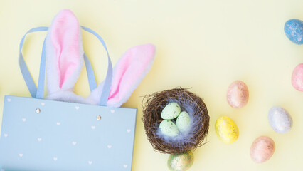 Easter composition with colorful eggs and gift bag