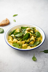 Homemade chicken curry with spinach and pea