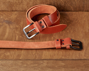 Wooden stand featuring leather belts with personalized embossment and engraving