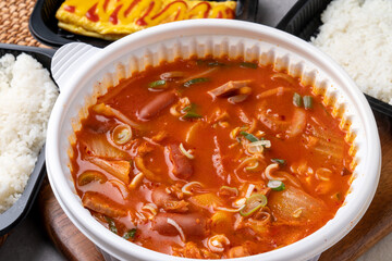 Korean food, kimchi stew, ham, soft tofu, pork, egg roll, rice, side dishes