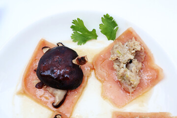 Shiitake mushrooms, minced pork, placed on steamed chicken ham