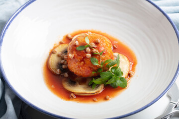 Contemporary gluten-free kitchen: buckwheat and chicken mince patties with mushrooms, tomato sauce, and micro basil greens. Focus on health