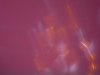 Yellow reflections on the wall for an abstract minimalist background.   