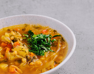 Vegetable soup on stone, top view