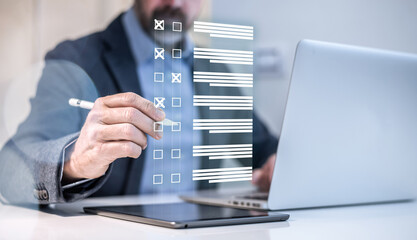 Man do online exam on virtual screen. Answer a survey filling out a tech form. Quiz, test concept