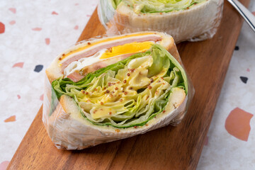 Salad, sandwich, ham, cheese, sweet pumpkin, almond, tomato, sprouts, vegetables, eggs, lettuce, sauce
