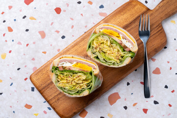 Salad, sandwich, ham, cheese, sweet pumpkin, almond, tomato, sprouts, vegetables, eggs, lettuce, sauce