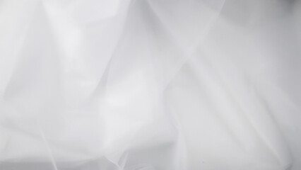 Beautiful layers of delicate light white fabric background.