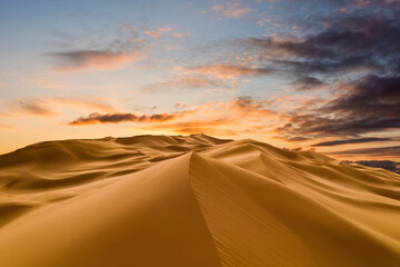Sunset over the sand dunes in the desert. Sahara desert