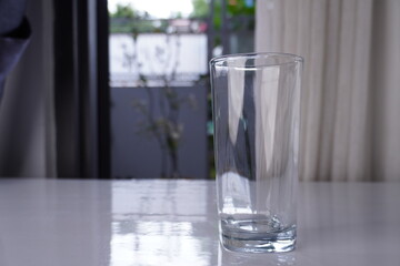 empty clear glass on top white table
