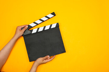 empty movie clapper a on yellow background
