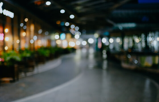 Abstract blur image of coffee shop or restaurant on night time with bokeh for background usage.