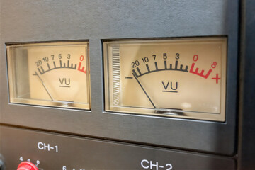 The image shows a vu meter with red and green markings, indicating the volume level of a sound. The...