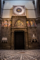 Fototapeta na wymiar Lowlight interior of Santa Maria del Fiore cathedral with counterclockwise and decorative paintings, Florence ITALY