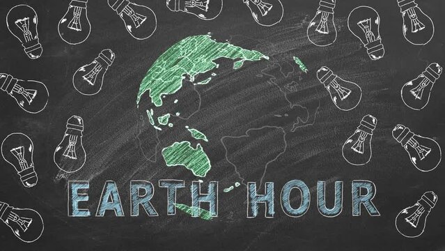 Rotating globe, glowing light bulbs and lettering EARTH HOUR hand drawn in chalk on a school blackboard. Save the World. Save our planet. World environment day.