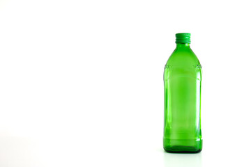 Large green empty glass bottle isolated on white