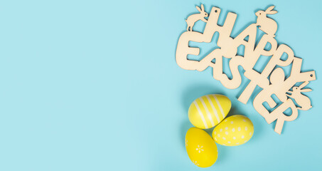 greeting card with text happy easter. multicolored easter eggs on pink background