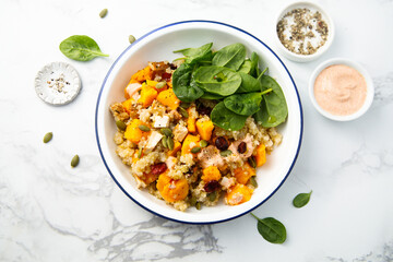Healthy quinoa bowl with pumpkin and cranberry