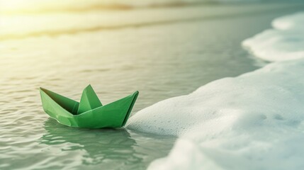 green paper boat on the water.